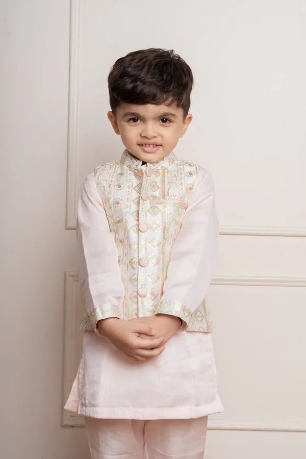 Elegant pastel pink kurta set with an intricately embroidered ivory jacket, perfect for festive occasions