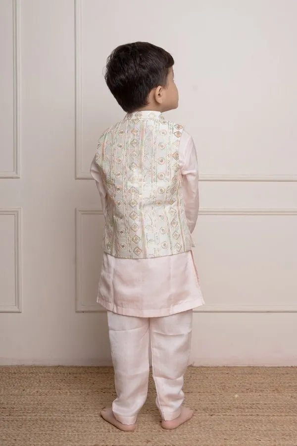 Elegant pastel pink kurta set with an intricately embroidered ivory jacket, perfect for festive occasions