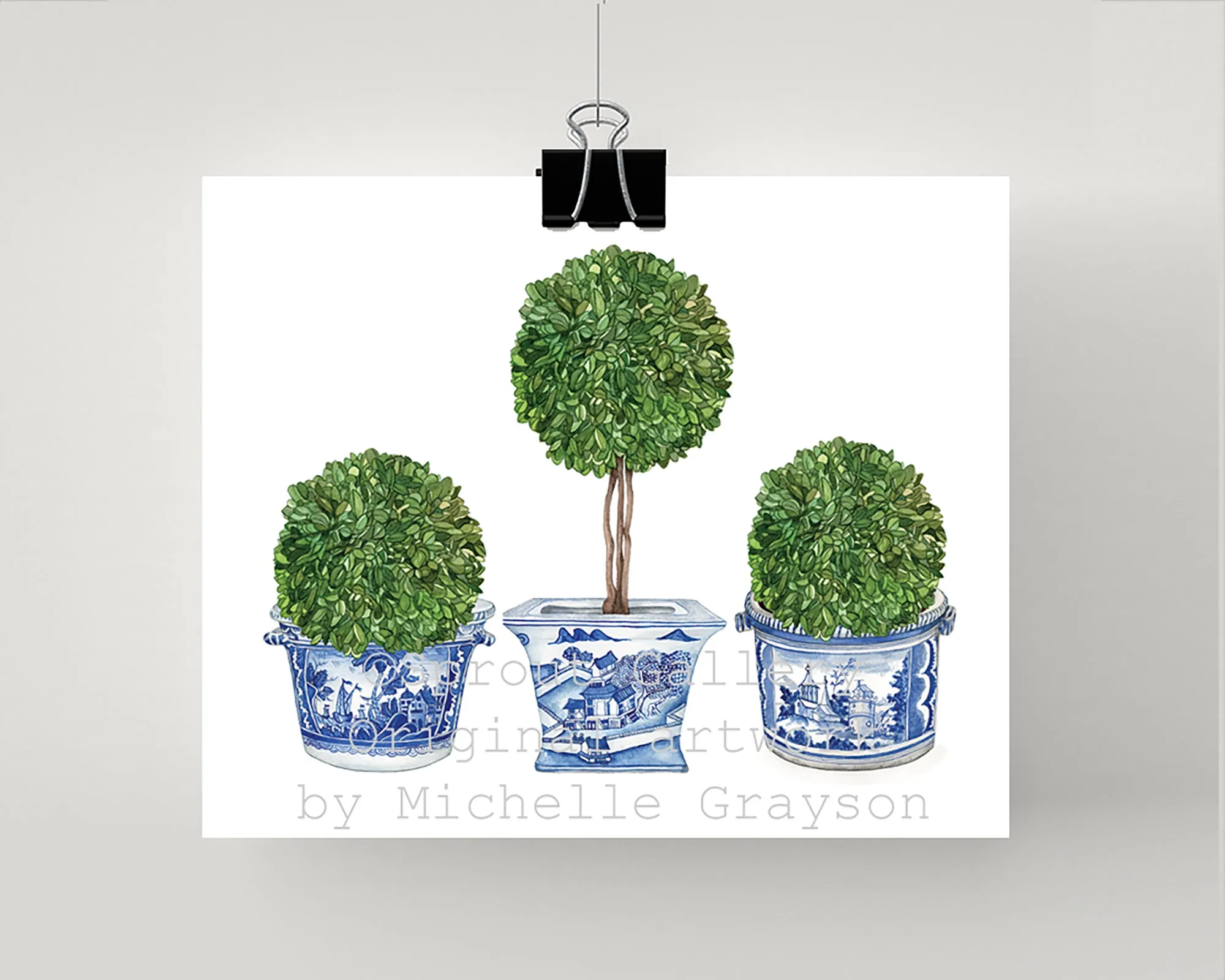 Print of double ball topiary tree in blue and white pot